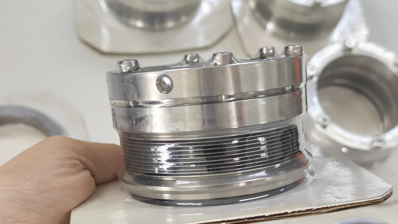 Hand holding a multi-spring mechanical seal component