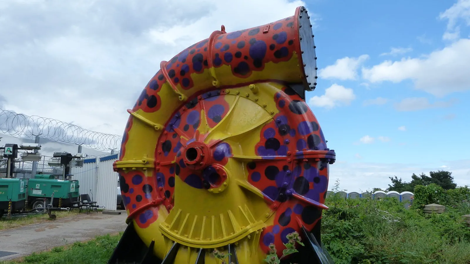 Split-case pump casing painted red and yellow outdoors