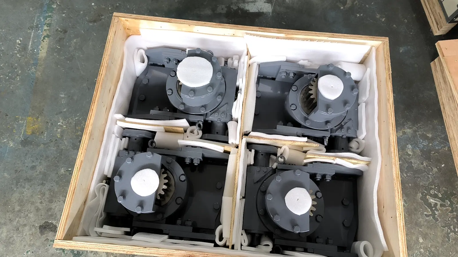 Export crates loaded with pump and motor units ready to ship